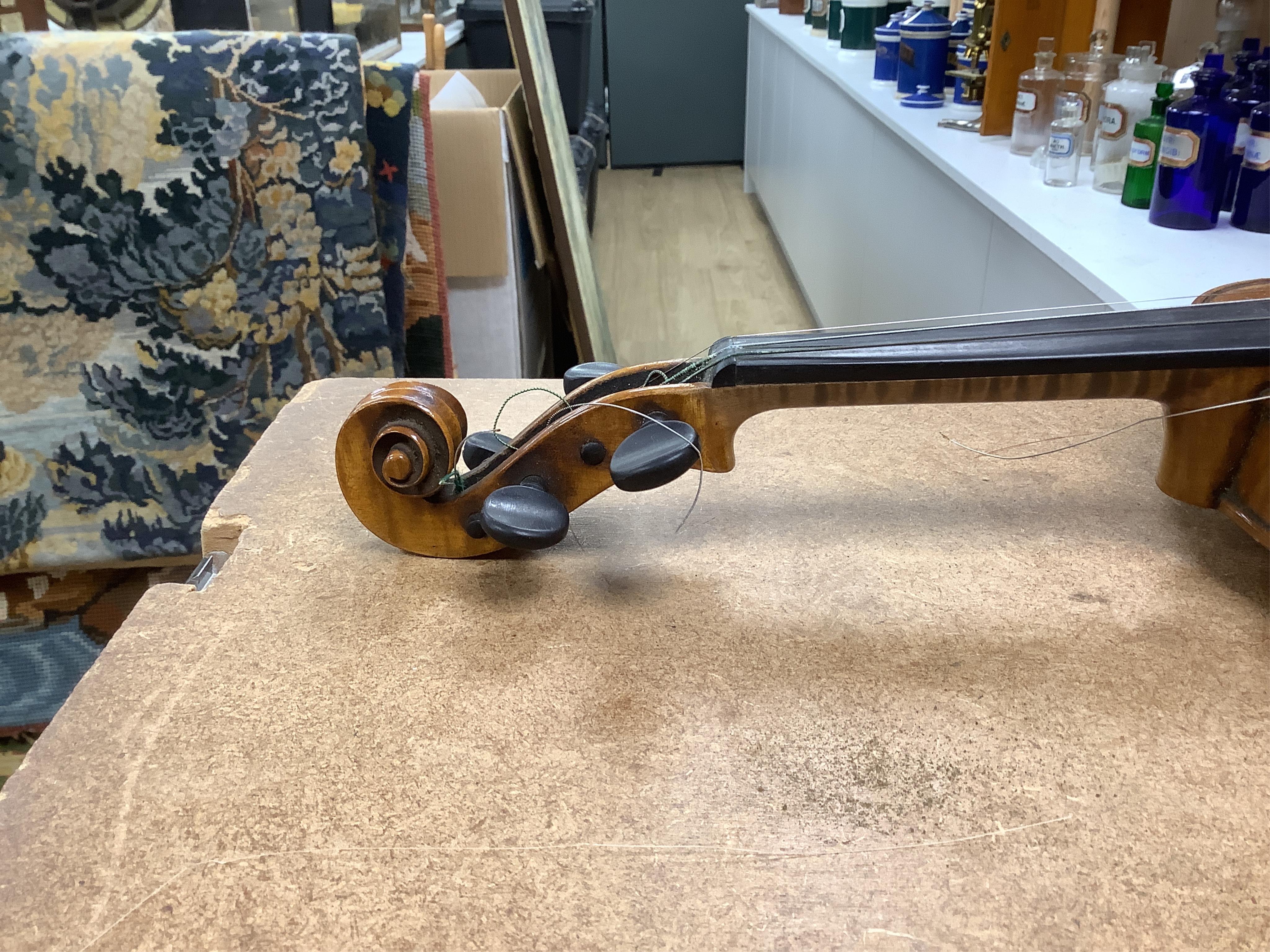 A late 19th century German violin in a Hill & Son oak case, with Hill canvas slip cover, together with an unbranded silver mounted bow, and another, ivory submission ref: 9HJU3B45 and ZC2E1GCP